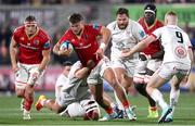 10 November 2023; Alex Nankivell of Munster is tackled by Eric O’Sullivan of Ulster during the United Rugby Championship match between Ulster and Munster at Kingspan Stadium in Belfast. Photo by Ramsey Cardy/Sportsfile