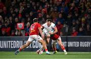 10 November 2023; Jacob Stockdale of Ulster is tackled by Munster players Craig Casey, right, and Alex Nankivell during the United Rugby Championship match between Ulster and Munster at Kingspan Stadium in Belfast. Photo by Seb Daly/Sportsfile