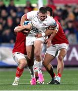 10 November 2023; Stuart McCloskey of Ulster is tackled by Gavin Coombes, left, and Alex Nankivell of Munster during the United Rugby Championship match between Ulster and Munster at Kingspan Stadium in Belfast. Photo by Ramsey Cardy/Sportsfile