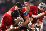 10 November 2023; Eric O'Sullivan of Ulster is tackled by Munster players, from left, Josh Wycherley, Tom Ahern and Fineen Wycherley during the United Rugby Championship match between Ulster and Munster at Kingspan Stadium in Belfast. Photo by Ramsey Cardy/Sportsfile