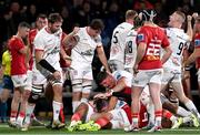 10 November 2023; Ulster players, from left, Iain Henderson, David McCann, Dave Ewers and Nathan Doak, celebrate their side's third try, scored by Nick Timoney, hidden, during the United Rugby Championship match between Ulster and Munster at Kingspan Stadium in Belfast. Photo by Ramsey Cardy/Sportsfile
