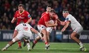 10 November 2023; Scott Buckley of Munster is tackled by Ulster players Nick Timoney, left, and Rob Herring during the United Rugby Championship match between Ulster and Munster at Kingspan Stadium in Belfast. Photo by Seb Daly/Sportsfile