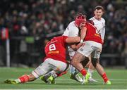 10 November 2023; Tom Stewart of Ulster is tackled by Munster players Gavin Coombes, left, and Diarmuid Barron during the United Rugby Championship match between Ulster and Munster at Kingspan Stadium in Belfast. Photo by Seb Daly/Sportsfile