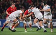 10 November 2023; Fineen Wycherley of Munster is tackled by Ulster players Cormac Izuchukwu, left, and Greg McGrath during the United Rugby Championship match between Ulster and Munster at Kingspan Stadium in Belfast. Photo by Seb Daly/Sportsfile