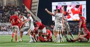 10 November 2023; Ulster players, including John Cooney, celebrate at the final whistle after their side's victory in the United Rugby Championship match between Ulster and Munster at Kingspan Stadium in Belfast. Photo by Seb Daly/Sportsfile