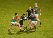 11 November 2023; Fiontan Eastwood of Fulham Irish in action against Mikey Murray, left, and Sam Callinan of Ballina Stephenites during the AIB Connacht GAA Football Senior Club Championship quarter-final match between Ballina Stephenites, Mayo, and Fulham Irish, London, at Hastings Insurance MacHale Park in Castlebar, Mayo. Photo by Piaras Ó Mídheach/Sportsfile