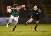 11 November 2023; Frank Irwin of Ballina Stephenites in action against Daniel Eastwood of Fulham Irish during the AIB Connacht GAA Football Senior Club Championship quarter-final match between Ballina Stephenites, Mayo, and Fulham Irish, London, at Hastings Insurance MacHale Park in Castlebar, Mayo. Photo by Piaras Ó Mídheach/Sportsfile