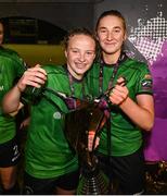 11 November 2023; Freya Healy, left, and Ellen Dolan of Peamount United celebrate with the SSE Airtricity Women's Premier Division trophy after the SSE Airtricity Women's Premier Division match between Peamount United and Sligo Rovers at PRL Park in Greenogue, Dublin. Photo by Stephen McCarthy/Sportsfile