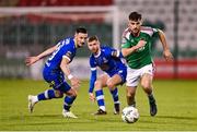 10 November 2023; Aaron Bolger of Cork City in action against Ronan Coughlan, left, and Barry Crowe Baggley of Waterford during the SSE Airtricity Men's Premier Division Promotion / Relegation play-off match between Waterford and Cork City at Tallaght Stadium in Dublin. Photo by Stephen McCarthy/Sportsfile
