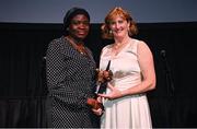 11 November 2023; Ade Adeleke, on behalf of Rhasidat Adeleke, is presented with the Sport Ireland Rising Star Award by Sport Ireland chief executive, Dr Una May on her behalf at the Team Ireland Olympic Ball at the Mansion House in Dublin. The event was a joint celebration of the brilliant performances of Team Ireland athletes at the European Games this summer, as well as the announcement of the winners of the Olympic Federation of Ireland Annual Awards. The event was attended by the Minister for Tourism, Culture, Arts, Gaeltacht, Sport and Media, Catherine Martin TD, Minister of State for Sport and Physical Education, Thomas Byrne TD, Olympic medallists, European Games athletes, Team Ireland Sponsors and Partners, Sport Ireland and the wider Olympic family. Photo by David Fitzgerald/Sportsfile