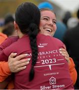 12 November 2023; Aoibhín O'Hara, right, embraces her sister Rebecca O'Hara after they completed the Remembrance Run 5K, supported by Silver Stream Healthcare, at the Phoenix Park in Dublin. Photo by Brendan Moran/Sportsfile