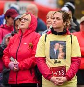 12 November 2023; Participants watch a big screen showing the names and photos of those who they have lost before the start of the Remembrance Run 5K, supported by Silver Stream Healthcare, at the Phoenix Park in Dublin. Photo by Brendan Moran/Sportsfile