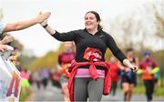 12 November 2023; A participant is encouraged during the Remembrance Run 5K, supported by Silver Stream Healthcare, at the Phoenix Park in Dublin. Photo by Brendan Moran/Sportsfile