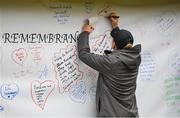 12 November 2023; Participants sign the wall of remembrance before the start of the Remembrance Run 5K, supported by Silver Stream Healthcare, at the Phoenix Park in Dublin. Photo by Brendan Moran/Sportsfile