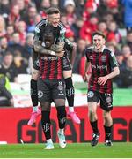 12 November 2023; Jonathan Afolabi of Bohemians celebrates with teammates Danny Grant, top, and James McManus after scoring their side's first goal during the Sports Direct FAI Cup Final between Bohemians and St Patrick's Athletic at the Aviva Stadium in Dublin. Photo by Stephen McCarthy/Sportsfile