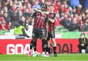 12 November 2023; Jonathan Afolabi of Bohemians celebrates with teammates Danny Grant, hidden, and James McManus, right, after scoring their side's first goal during the Sports Direct FAI Cup Final between Bohemians and St Patrick's Athletic at the Aviva Stadium in Dublin. Photo by Stephen McCarthy/Sportsfile