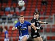 12 November 2023; Conor McCarthy of Scotstown in action against Ceilum Doherty of Kilcoo during the AIB Ulster GAA Football Senior Club Championship quarter-final match between Kilcoo, Down, and Scotstown, Monaghan, at Pairc Esler in Newry, Down. Photo by Stephen Marken/Sportsfile