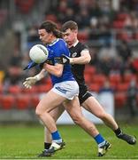 12 November 2023; Brendan Boylan of Scotstown is tackled by Jack Devlin of Kilcoo during the AIB Ulster GAA Football Senior Club Championship quarter-final match between Kilcoo, Down, and Scotstown, Monaghan, at Pairc Esler in Newry, Down. Photo by Stephen Marken/Sportsfile