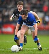 12 November 2023; Brendan Boylan of Scotstown in action against Jack Devlin of Kilcoo during the AIB Ulster GAA Football Senior Club Championship quarter-final match between Kilcoo, Down, and Scotstown, Monaghan, at Pairc Esler in Newry, Down. Photo by Stephen Marken/Sportsfile