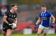 12 November 2023; Shealan Johnston of Kilcoo in action against Damien McArdle of Scotstown during the AIB Ulster GAA Football Senior Club Championship quarter-final match between Kilcoo, Down, and Scotstown, Monaghan, at Pairc Esler in Newry, Down. Photo by Stephen Marken/Sportsfile