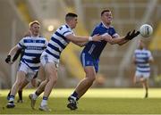 12 November 2023; Sean Collins of Cratloe is tackled by Rory Maguire of Castlehaven during the AIB Munster GAA Football Senior Club Championship quarter-final match between Castlehaven, Cork, and Cratloe, Clare, at Páirc Uí Chaoimh in Cork. Photo by Tom Beary/Sportsfile