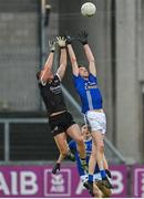 12 November 2023; Aaron Morgan of Kilcoo in action against James Hammill of Scotstown during the AIB Ulster GAA Football Senior Club Championship quarter-final match between Kilcoo, Down, and Scotstown, Monaghan, at Pairc Esler in Newry, Down. Photo by Stephen Marken/Sportsfile