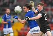 12 November 2023; Brendan Boylan of Scotstown in action against Jack Devlin of Kilcoo during the AIB Ulster GAA Football Senior Club Championship quarter-final match between Kilcoo, Down, and Scotstown, Monaghan, at Pairc Esler in Newry, Down. Photo by Stephen Marken/Sportsfile