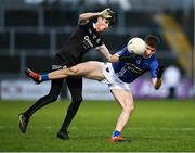 12 November 2023; Mattie Maguire of Scotstown is fouled by Eugen Branagan of Kilcoo during the AIB Ulster GAA Football Senior Club Championship quarter-final match between Kilcoo, Down, and Scotstown, Monaghan, at Pairc Esler in Newry, Down. Photo by Stephen Marken/Sportsfile