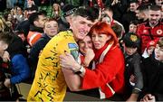 12 November 2023; Joe Redmond of St Patrick's Athletic celebrates with his mother Suzanne and sister Abby after the Sports Direct FAI Cup Final between Bohemians and St Patrick's Athletic at the Aviva Stadium in Dublin. Photo by Seb Daly/Sportsfile