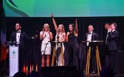 11 November 2023; Attendees, from left, MC Greg O'Shea, Sarah Lavin, Erin King, Marian Heffernan, Rob Heffernan, Jordan Conroy, and Noel Hendricks on stage at the Team Ireland Olympic Ball at the Mansion House in Dublin. The event was a joint celebration of the brilliant performances of Team Ireland athletes at the European Games this summer, as well as the announcement of the winners of the Olympic Federation of Ireland Annual Awards. The event was attended by the Minister for Tourism, Culture, Arts, Gaeltacht, Sport and Media, Catherine Martin TD, Minister of State for Sport and Physical Education, Thomas Byrne TD, Olympic medallists, European Games athletes, Team Ireland Sponsors and Partners, Sport Ireland and the wider Olympic family. Photo by David Fitzgerald/Sportsfile