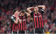 12 November 2023; Bohemians players Jordan Flores, right, Ali Coote, left, and Bartlomiej Kukulowicz, behind react during the Sports Direct FAI Cup Final between Bohemians and St Patrick's Athletic at the Aviva Stadium in Dublin. Photo by Seb Daly/Sportsfile