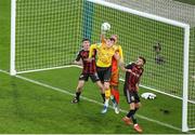 12 November 2023; Bohemians goalkeeper James Talbot punches the ball clear under pressure from Conor Carty of St Patrick's Athletic during the Sports Direct FAI Cup Final between Bohemians and St Patrick's Athletic at the Aviva Stadium in Dublin. Photo by Michael P Ryan/Sportsfile