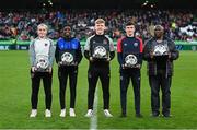 12 November 2023; EA Sports League of Ireland Academy players of the year, from left, Ceola Bergin of Wexford Youths with the EA Sports League of Ireland Academy WU19 2023 Player of the Year award, Mary Philips of Athlone Town with the EA Sports League of Ireland Academy WU17 2023 Player of the Year award, Cian Curtis of Shamrock Rovers with the EA Sports League of Ireland Academy MU19 2023 Player of the Year award, Niall Sullivan of St Patrick's Athletic with the EA Sports League of Ireland Academy MU14 2023 Player of the Year award and Romanus Akachukwu accepting the EA Sports League of Ireland Academy MU17 2023 Player of the Year award on behalf of his son Romeo Akachukwu of Waterford FC at half-time of the Sports Direct FAI Cup Final between Bohemians and St Patrick's Athletic at the Aviva Stadium in Dublin. Photo by Stephen McCarthy/Sportsfile