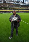 12 November 2023; Romanus Akachukwu accepting the EA Sports League of Ireland Academy MU17 2023 Player of the Year award on behalf of his son Romeo Akachukwu of Waterford FC at half-time of the Sports Direct FAI Cup Final between Bohemians and St Patrick's Athletic at the Aviva Stadium in Dublin. Photo by Stephen McCarthy/Sportsfile