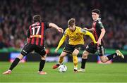 12 November 2023; Adam Murphy of St Patrick's Athletic in action against Adam McDonnell, left, and James Clarke of Bohemians during the Sports Direct FAI Cup Final between Bohemians and St Patrick's Athletic at the Aviva Stadium in Dublin. Photo by Stephen McCarthy/Sportsfile