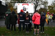 12 November 2023; Participants watch the big screen for names of loved ones before the Remembrance Run 5K, supported by Silver Stream Healthcare, at the Phoenix Park in Dublin. Photo by Brendan Moran/Sportsfile