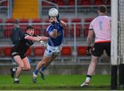 12 November 2023; Darren Hughes of Scotstown in action against Anthony Morgan of Kilcoo during the AIB Ulster GAA Football Senior Club Championship quarter-final match between Kilcoo, Down, and Scotstown, Monaghan, at Pairc Esler in Newry, Down. Photo by Stephen Marken/Sportsfile