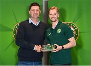 13 November 2023; Goalkeeper Caoimhin Kelleher is presented with his 2022-2023 Republic of Ireland international cap by former Republic of Ireland player Niall Quinn at the Castleknock Hotel in Dublin. Photo by Stephen McCarthy/Sportsfile