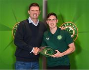 13 November 2023; Jamie McGrath is presented with his 2022-2023 Republic of Ireland international cap by former Republic of Ireland player Niall Quinn at the Castleknock Hotel in Dublin. Photo by Stephen McCarthy/Sportsfile