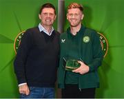 13 November 2023; Nathan Collins is presented with his 2022-2023 Republic of Ireland international cap by former Republic of Ireland player Niall Quinn at the Castleknock Hotel in Dublin. Photo by Stephen McCarthy/Sportsfile