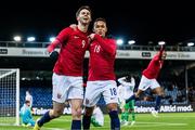 17 November 2023; Lasse Nordås of Norway, left, celebrates with team-mate Fredrik Oppegard after scoring his side's third goal during the UEFA European Under-21 Championship Qualifier match between Norway and Republic of Ireland at Marienlyst Stadion in Drammen, Norway. Photo by Marius Simensen/Sportsfile