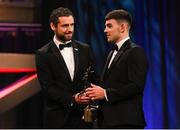 17 November 2023; Mark Rodgers of Clare is presented with his PwC GAA/GPA Young Hurler of the Year award by Gaelic Players Association chief executive Tom Parsons during the 2023 PwC GAA/GPA All-Star Awards at the RDS in Dublin. Photo by Brendan Moran/Sportsfile