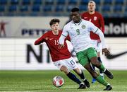 17 November 2023; Sinclair Armstrong of Republic of Ireland in action against Odin Thiago Holm of Norway during the UEFA European Under-21 Championship Qualifier match between Norway and Republic of Ireland at Marienlyst Stadion in Drammen, Norway. Photo by Marius Simensen/Sportsfile