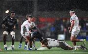 17 November 2023; Edwill van der Merwe of Emirates Lions is tackled by Jake Flannery, left, and Reuben Crothers of Ulster during the United Rugby Championship match between Ulster and Emirates Lions at Kingspan Stadium in Belfast. Photo by Ramsey Cardy/Sportsfile