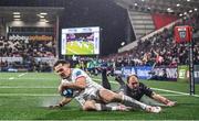 17 November 2023; Jacob Stockdale of Ulster scores his side's second try despite the tackle of PJ Botha of Emirates Lions during the United Rugby Championship match between Ulster and Emirates Lions at Kingspan Stadium in Belfast. Photo by Ramsey Cardy/Sportsfile