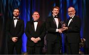 17 November 2023; Brendan Rogers of Derry is presented with his PwC All-Star award by Uachtarán Chumann Lúthchleas Gael Larry McCarthy, in the company of Gaelic Players Association chief executive Tom Parsons, left, and PwC managing partner Enda McDonagh during the 2023 PwC GAA/GPA All-Star Awards at the RDS in Dublin. Photo by Brendan Moran/Sportsfile