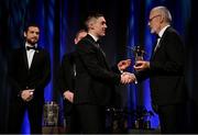 17 November 2023; Conor McCluskey of Derry is presented with his PwC All-Star award by Uachtarán Chumann Lúthchleas Gael Larry McCarthy, in the company of Gaelic Players Association chief executive Tom Parsons during the 2023 PwC GAA/GPA All-Star Awards at the RDS in Dublin.Uachtarán Chumann Lúthchleas Gael Larry McCarthy Photo by Brendan Moran/Sportsfile