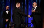 17 November 2023; Stephen Cluxton of Dublin is presented with his PwC All-Star award by Uachtarán Chumann Lúthchleas Gael Larry McCarthy, in the company of Gaelic Players Association chief executive Tom Parsons during the 2023 PwC GAA/GPA All-Star Awards at the RDS in Dublin.Uachtarán Chumann Lúthchleas Gael Larry McCarthy Photo by Brendan Moran/Sportsfile