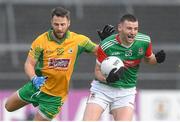 18 November 2023; Jack Irwin of Ballina Stephenites in action against Michael Lundy of Corofin during the AIB Connacht GAA Football Senior Club Championship Semi-Final match between Corofin, Galway, and Ballina Stephenites, Mayo, at Pearse Stadium, Galway. Photo by Ray Ryan/Sportsfile