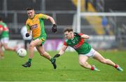 18 November 2023; Brian Cogger of Corofin in action against Sean Regan of Ballina Stephenites during the AIB Connacht GAA Football Senior Club Championship Semi-Final match between Corofin, Galway, and Ballina Stephenites, Mayo, at Pearse Stadium, Galway. Photo by Ray Ryan/Sportsfile